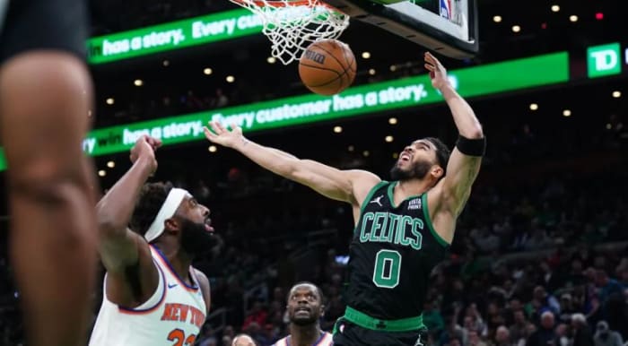Mitchell Robinson and Julius Randle can only watch as two of Jayson Tatum's 35 points fall in Monday's loss in Boston